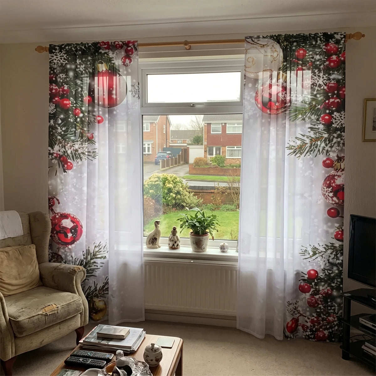 The Aurelinneva Christmas curtains at the living-room window in daylight, with the garden visible through the sheer voile