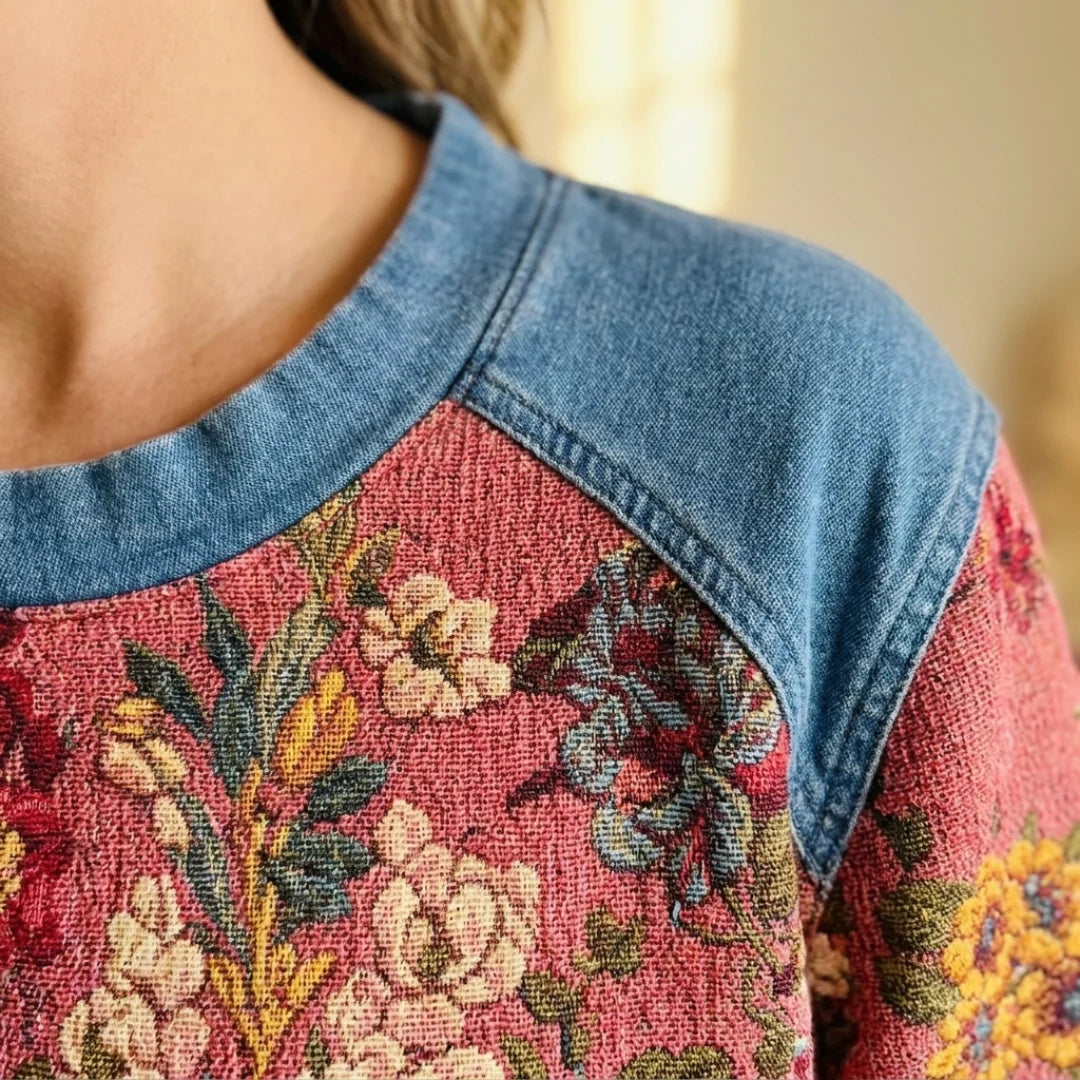 Close-up of the denim-blue yoke and crew neck of the Charlene