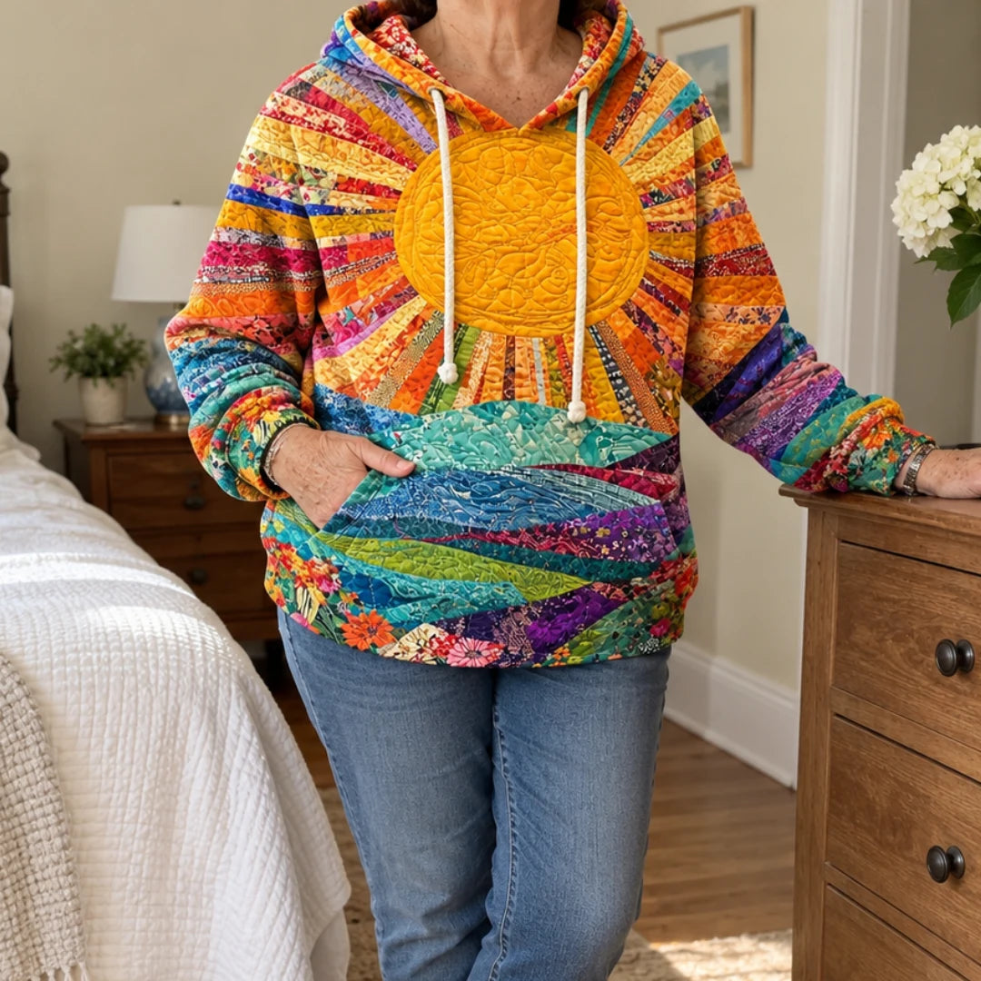 Woman at home in the Amanda quilted sunflower hoodie with jeans